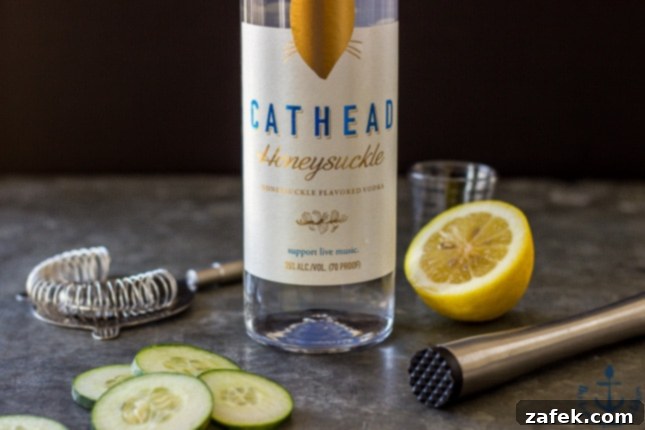 The Purring Blur 5 A bottle of Cathead Honeysuckle Vodka, the key ingredient for The Tipsy Cat cocktail, sits among fresh ingredients.