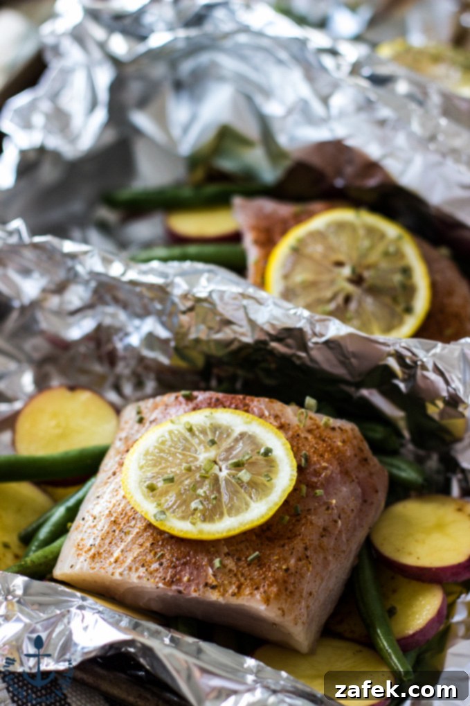 Savory Grilled Mahi Mahi and Veggie Foil Bundles 3 Perfectly Cooked Mahi Mahi Fillets with Fresh Green Beans and Baby Potatoes