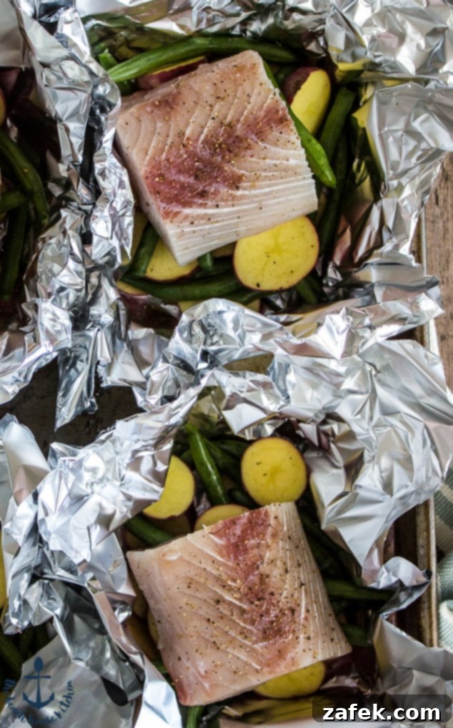 Savory Grilled Mahi Mahi and Veggie Foil Bundles 6 Close-up of Fresh Mahi Mahi Fillets Ready for Seasoning