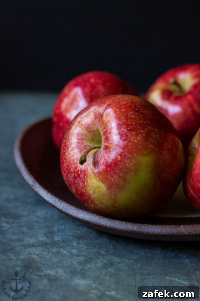 Freshly baked Apple Spice Crumb Muffins cooling on a rack