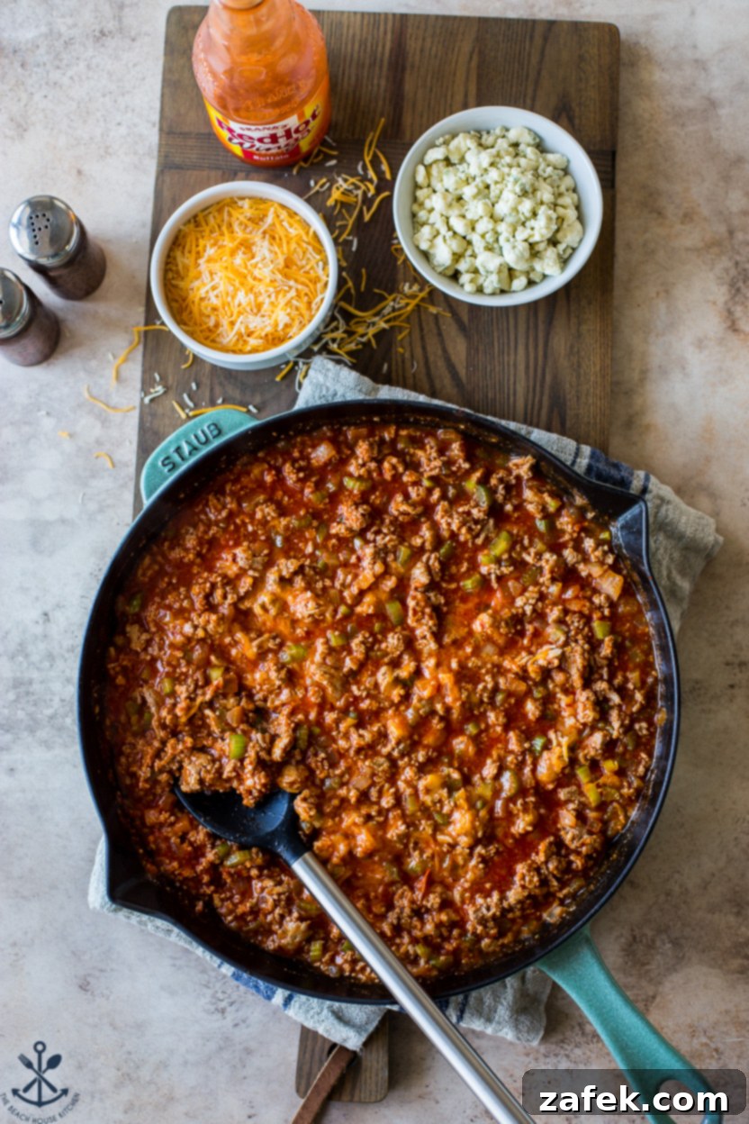 Spicy Buffalo Sloppy Joes 2 Overhead photo of a skillet of buffalo sloppy joe mix, ready to be served on buns.