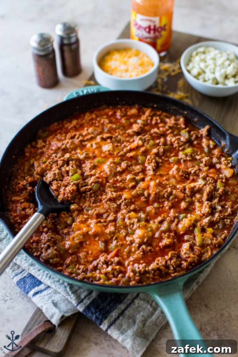 Spicy Buffalo Sloppy Joes 8 A skillet full of finished Buffalo Sloppy Joes, rich and bubbly, ready to be scooped onto buns.