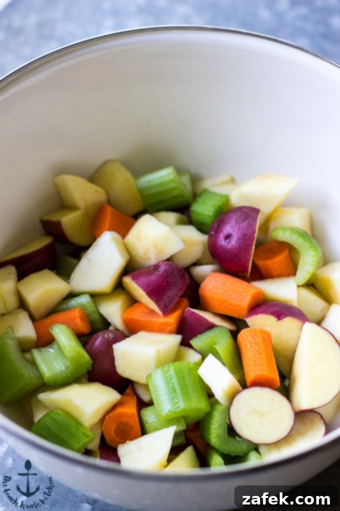 Ale-Braised Pork & Apple Stew with Hearty Vegetables 6 Ale Braised Pork Stew simmering in a Dutch oven.