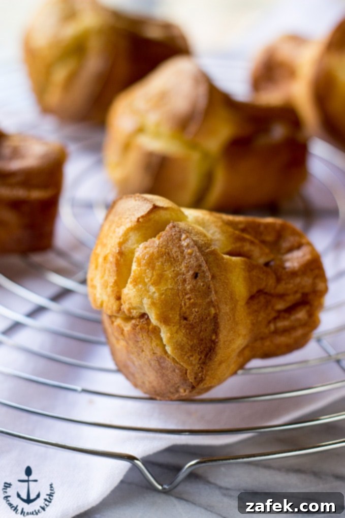 Aromatic Chai Clouds 3 Close-up of a single Chai Spiced Popover, golden brown and perfectly puffed