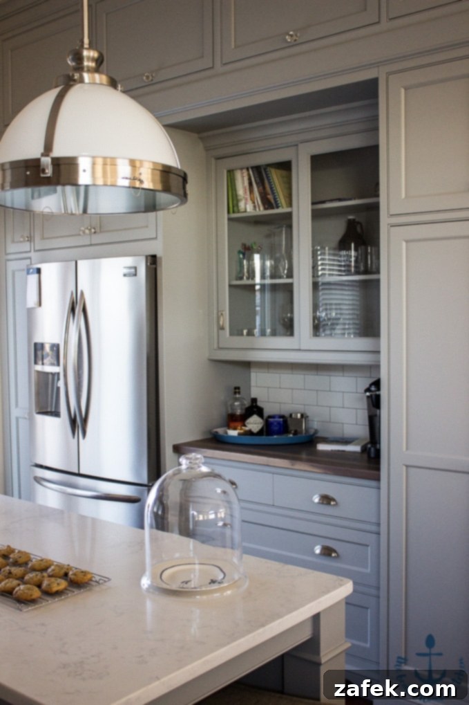 Warm Gray Custom Cabinets in a Coastal Kitchen Design