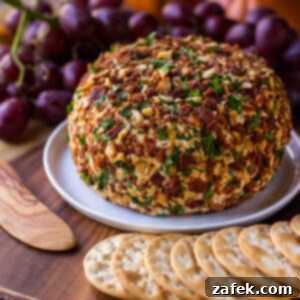 Classic Jalapeño Bacon Ranch Cheese Ball, perfectly rounded and coated for a festive presentation.