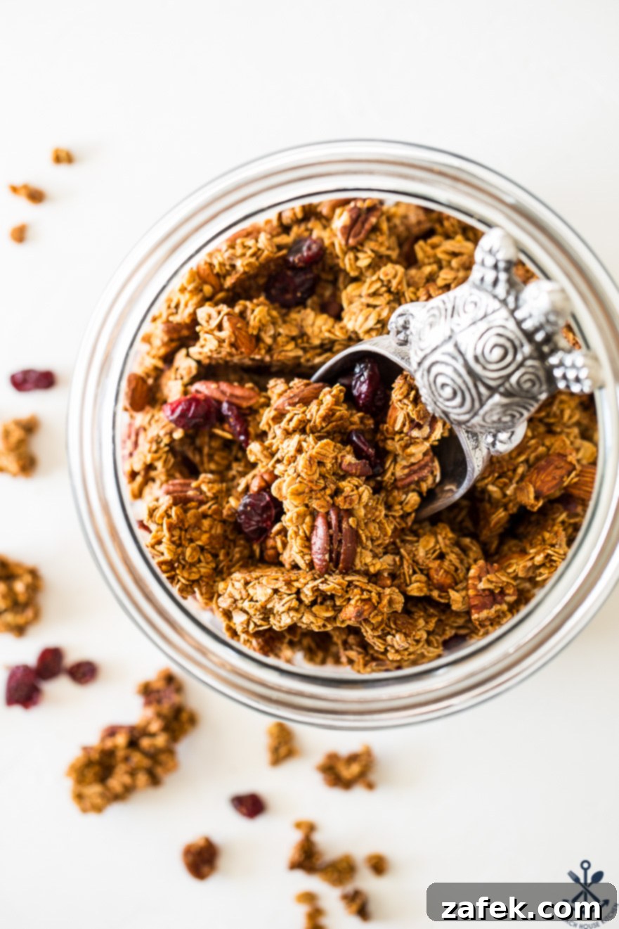 Overhead photo of jar filled with maple cinnamon granola