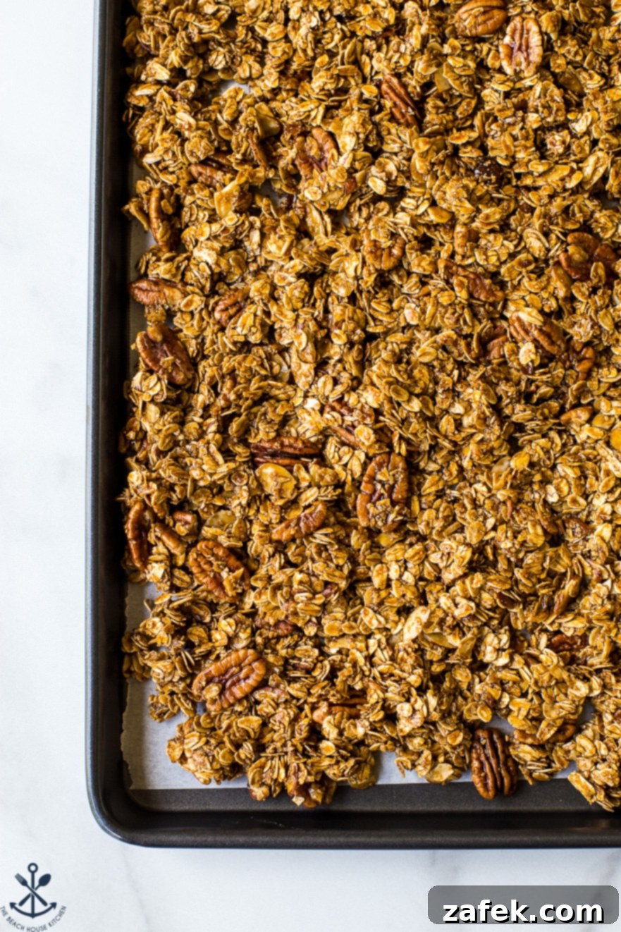 Overhead photo of cookie sheet filled with maple cinnamon granola