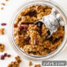 Overhead photo of glass jar filled with maple cinnamon granola