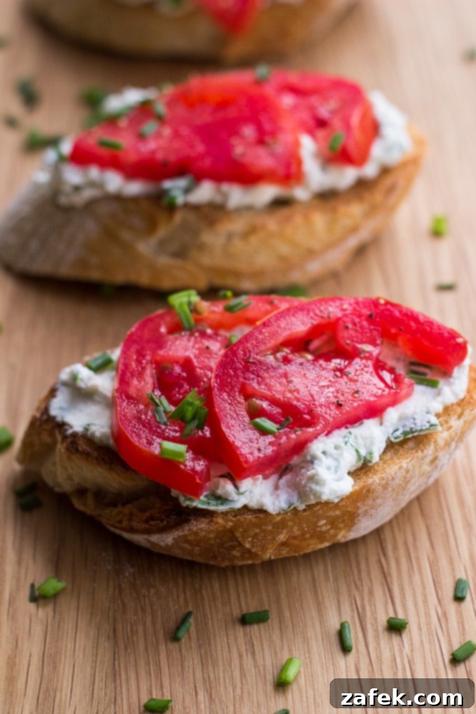 Garden Tomato and Herb Ricotta Toasts 3 Herbed Ricotta and Tomato Crostini close-up with fresh basil