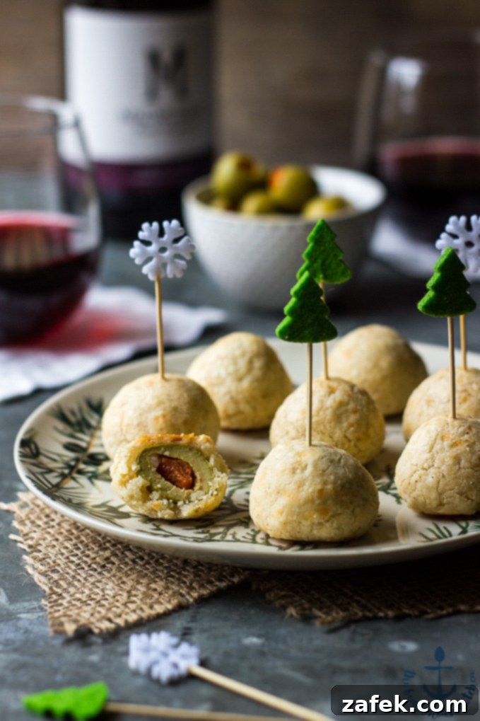 Zesty Olive Poppers 2 Olive Balls on a plate with fancy toothpicks, showcasing a delightful appetizer