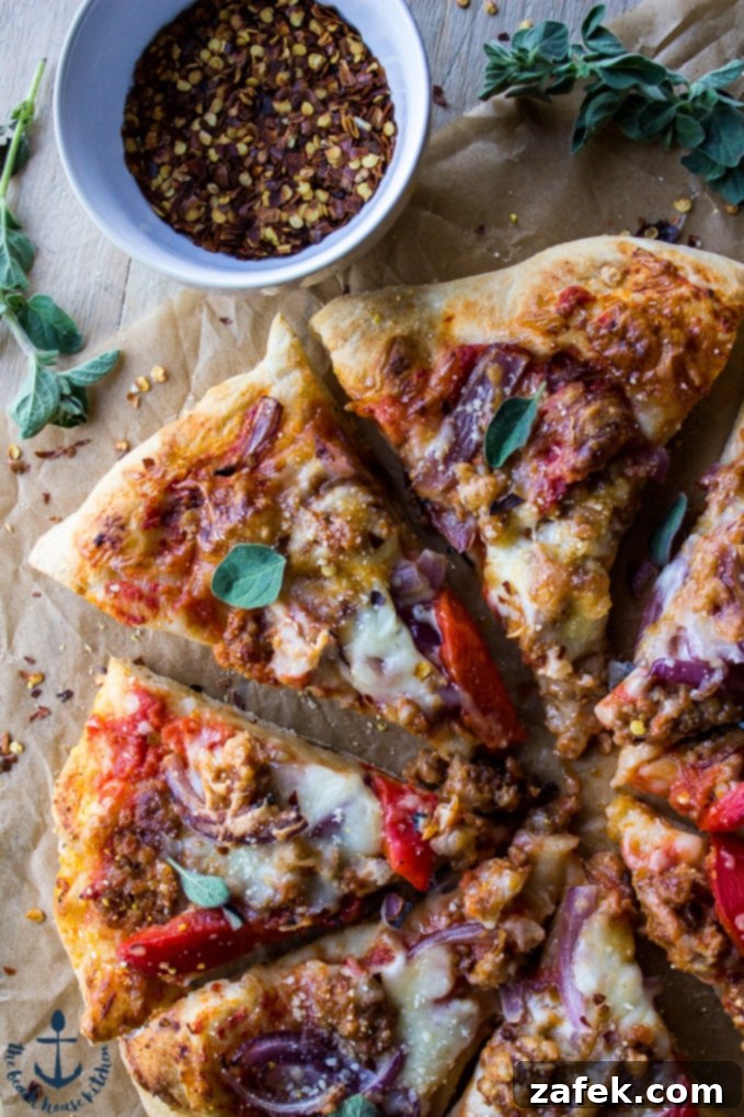 Spicy Sausage Pizza with Roasted Red Pepper and Onion