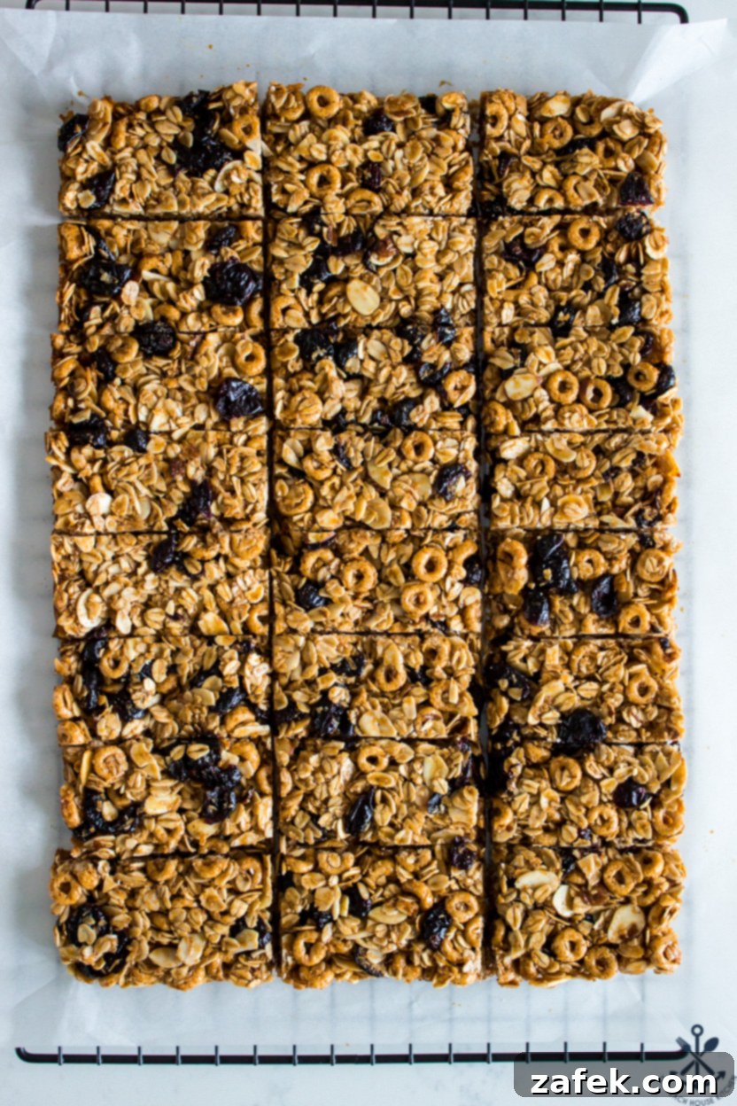 Overhead photo of neatly sliced granola bars arranged on a wire cooling rack