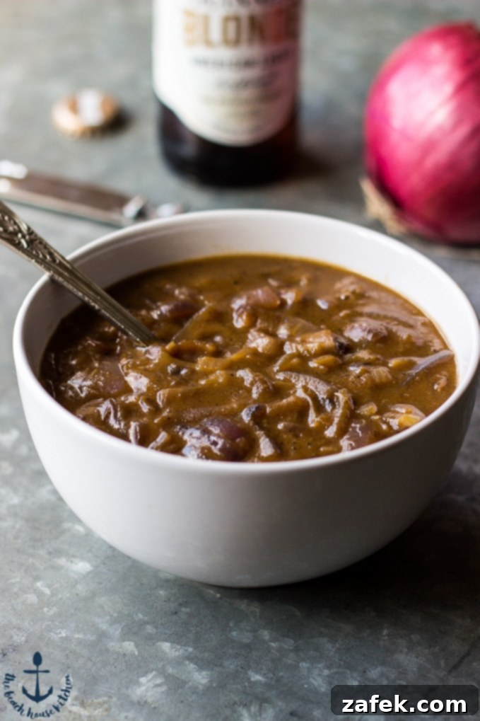 Guinness Onion Gravy Elevates Bangers and Mash 3 Close-up of golden brown banger sausages ready to be served