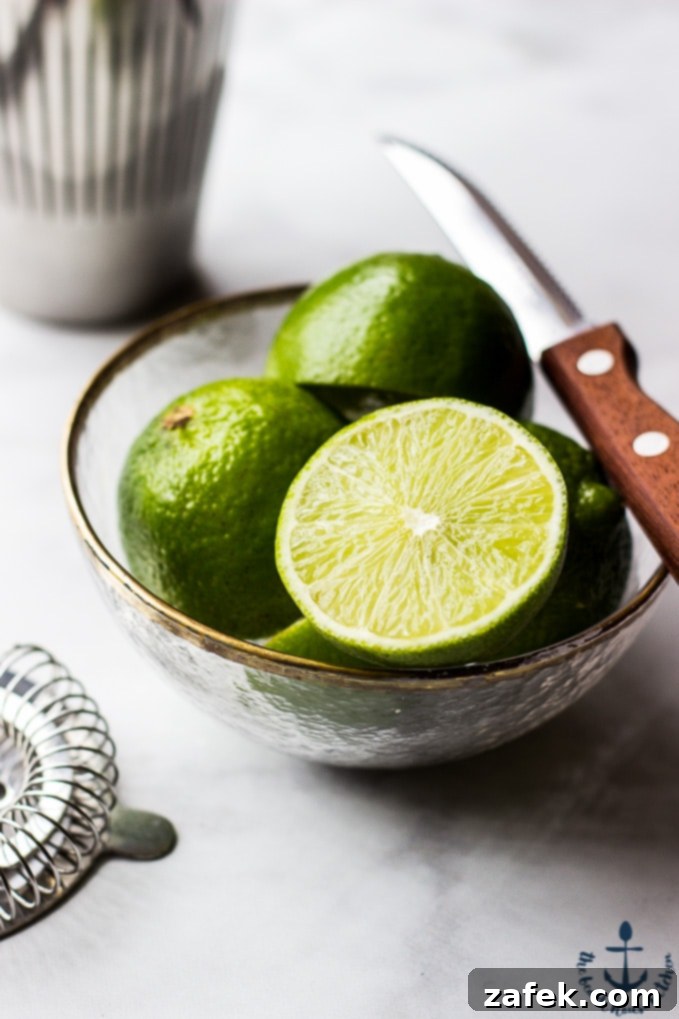 Scarlet Zest Gimlet 5 A beautifully garnished Ruby Red Gimlet cocktail in a coupe glass, ready to be enjoyed