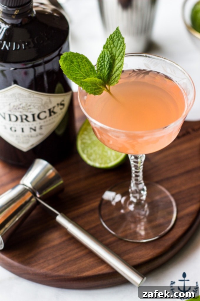 Scarlet Zest Gimlet 6 Ruby Red Gimlet cocktails elegantly displayed on a custom walnut serving board