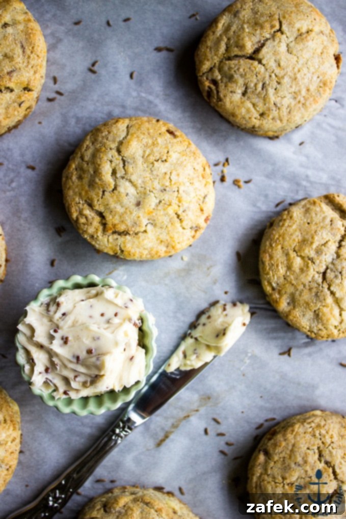 A plate of Rye Scones with Bacon and Jarlsberg alongside a bowl of stone ground mustard butter