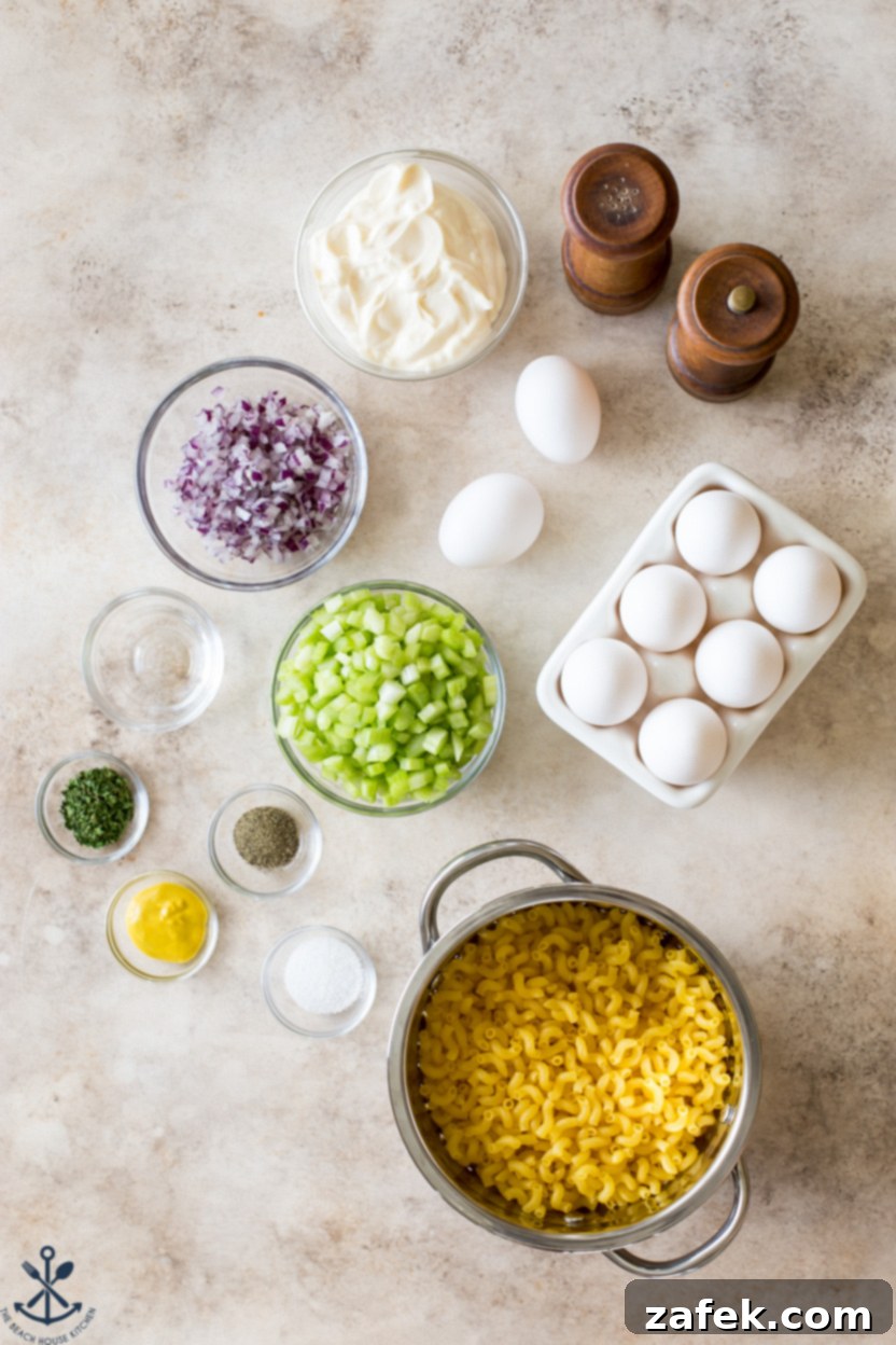 Easy Macaroni Salad From Gram 4 Overhead photo of individual ingredients for macaroni salad displayed in small bowls, including hard-boiled eggs, chopped celery, and red onion.