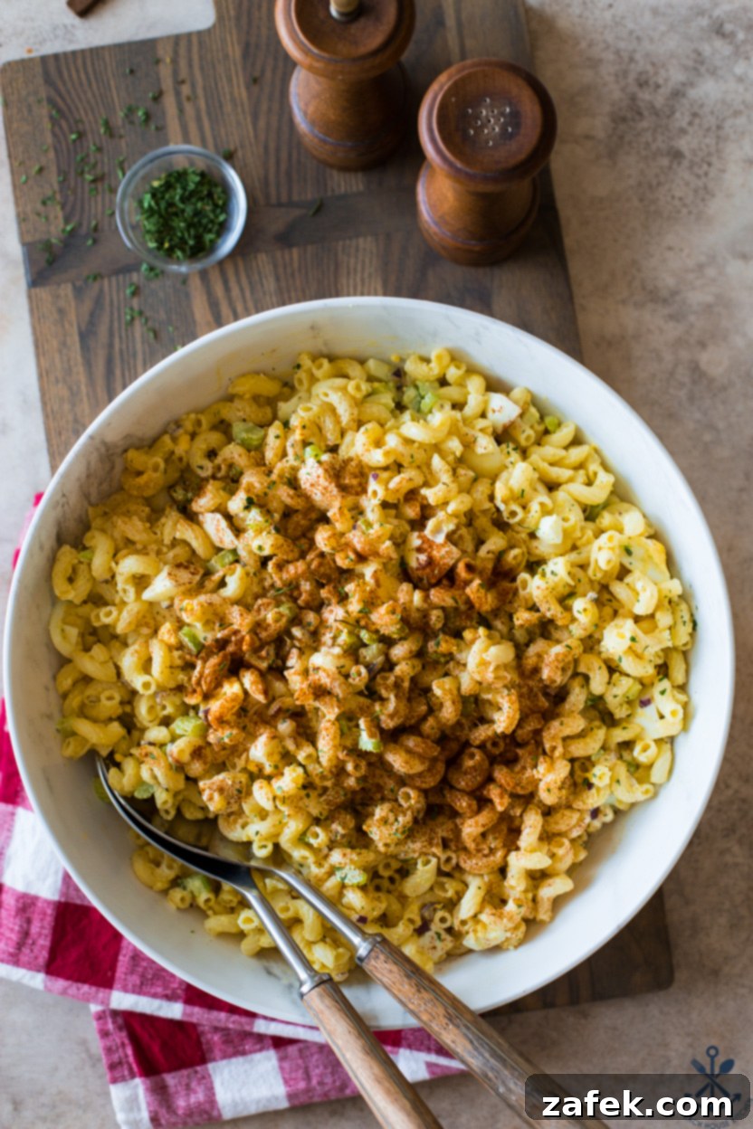 Easy Macaroni Salad From Gram 5 Overhead photo of a bowl of macaroni salad generously sprinkled with paprika, ready to be served.