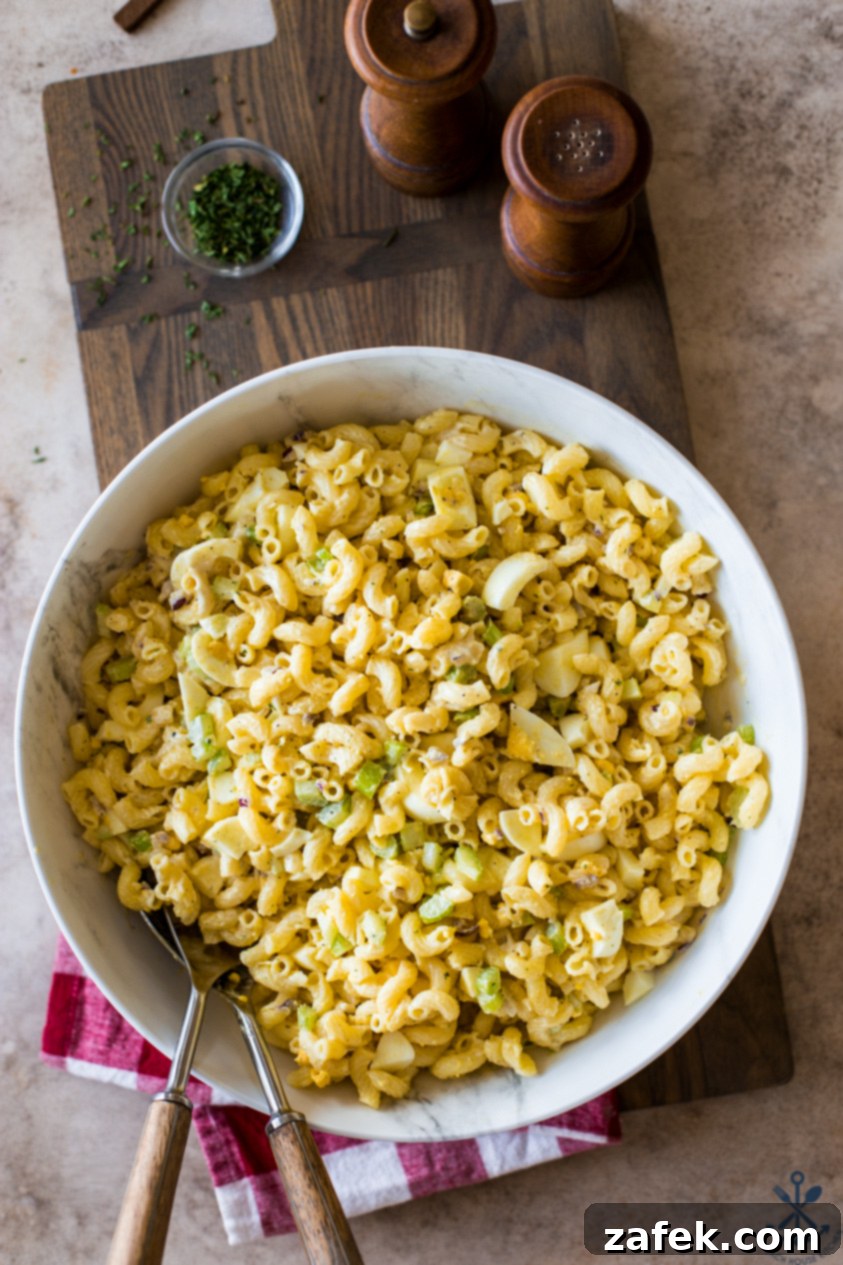 Easy Macaroni Salad From Gram 9 Overhead photo of a beautifully presented bowl of classic macaroni salad, garnished and ready to serve.
