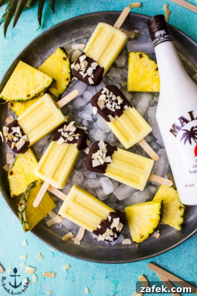 Sunshine Piña Pops 4 Boozy Piña Colada Popsicles with chocolate dip and toasted coconut