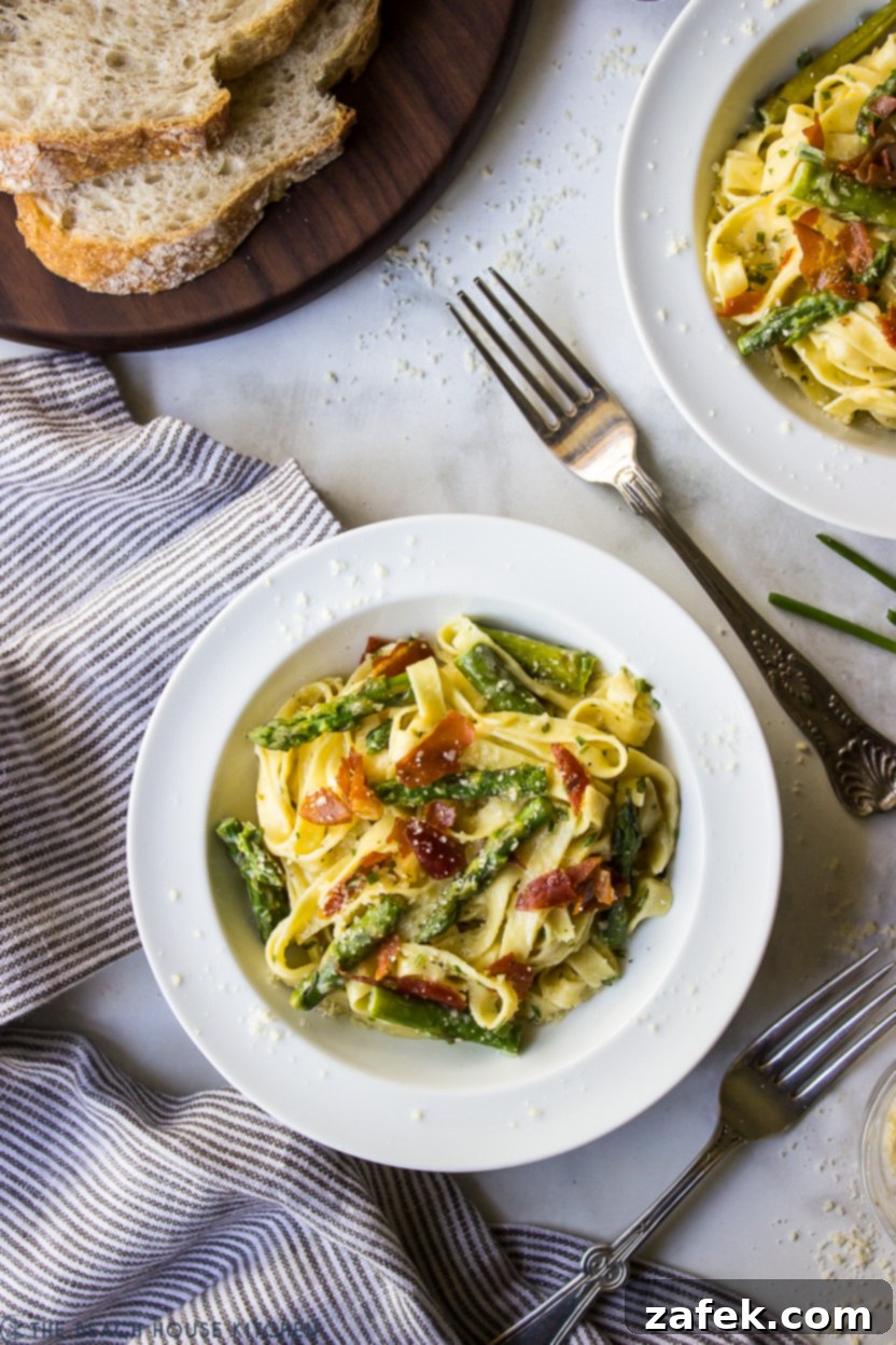 Crispy Prosciutto and Tender Asparagus Fettuccine Alfredo 5 Overhead photo of a bowl of Fettuccine Alfredo with asparagus and prosciutto, glistening with creamy sauce