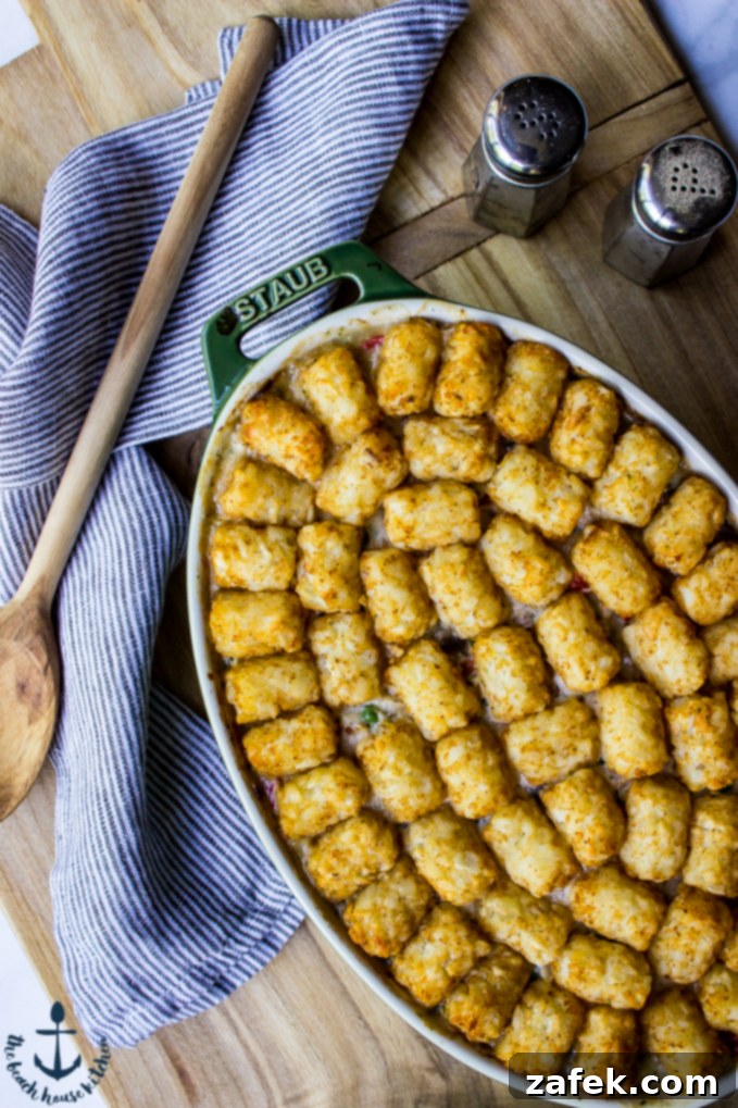 Fisherman's Pie 5 Tater Tot Topped Seafood Pot Pie - A wide shot of the baked dish, golden and bubbling.