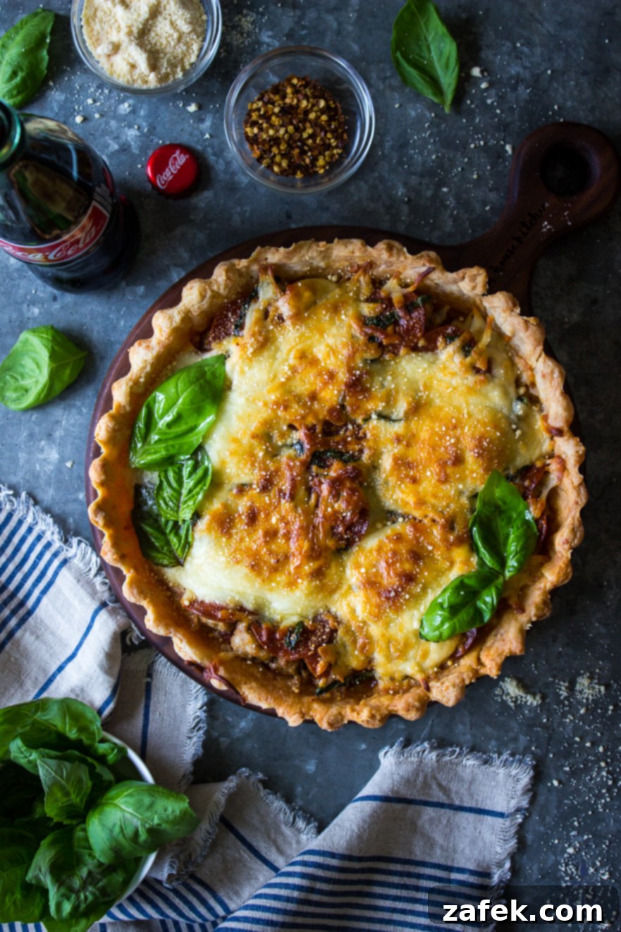 Delicious Pepperoni and Sausage Pizza Tart with Savory Parmesan Crust