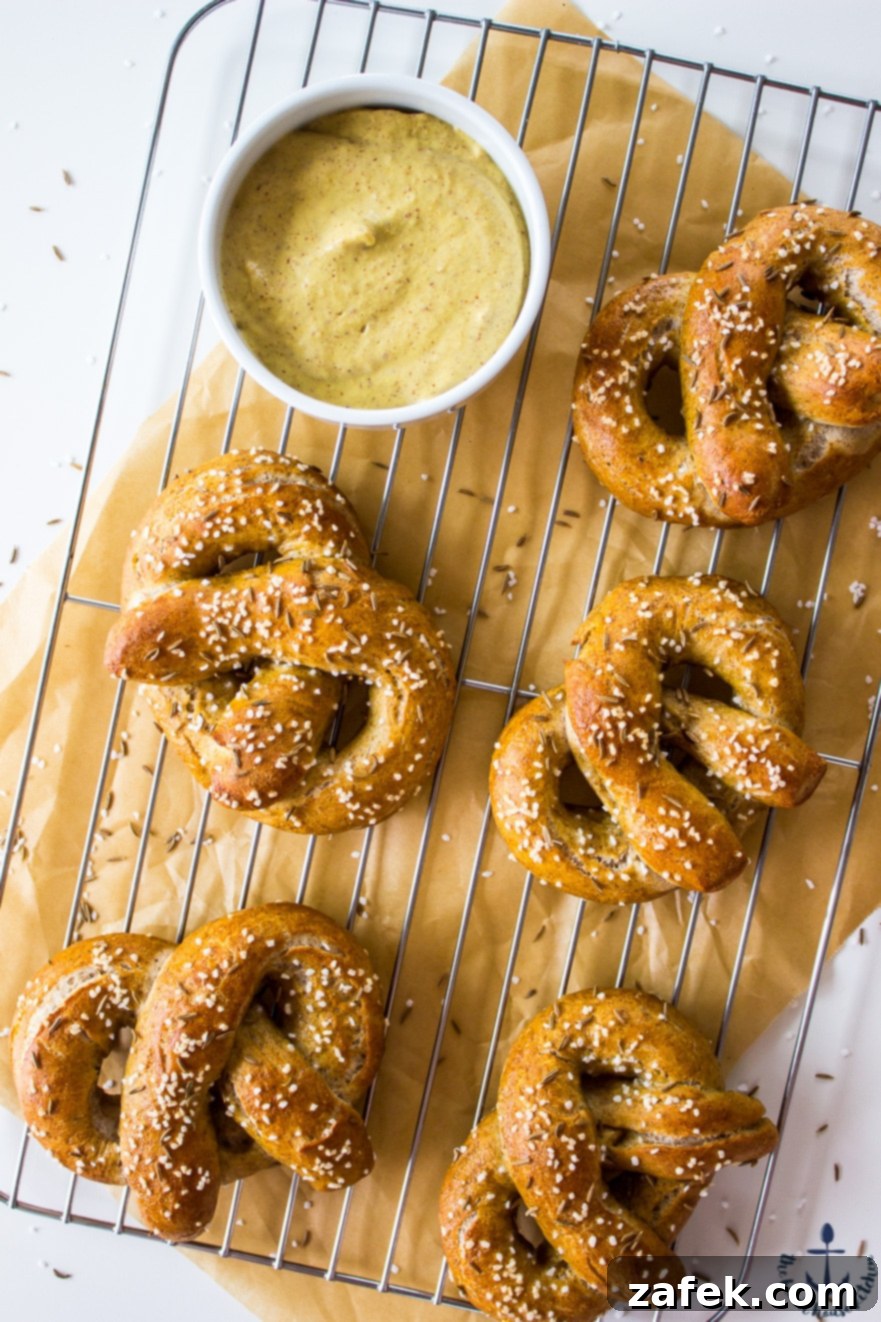 Golden brown Rye Soft Pretzels on a baking sheet
