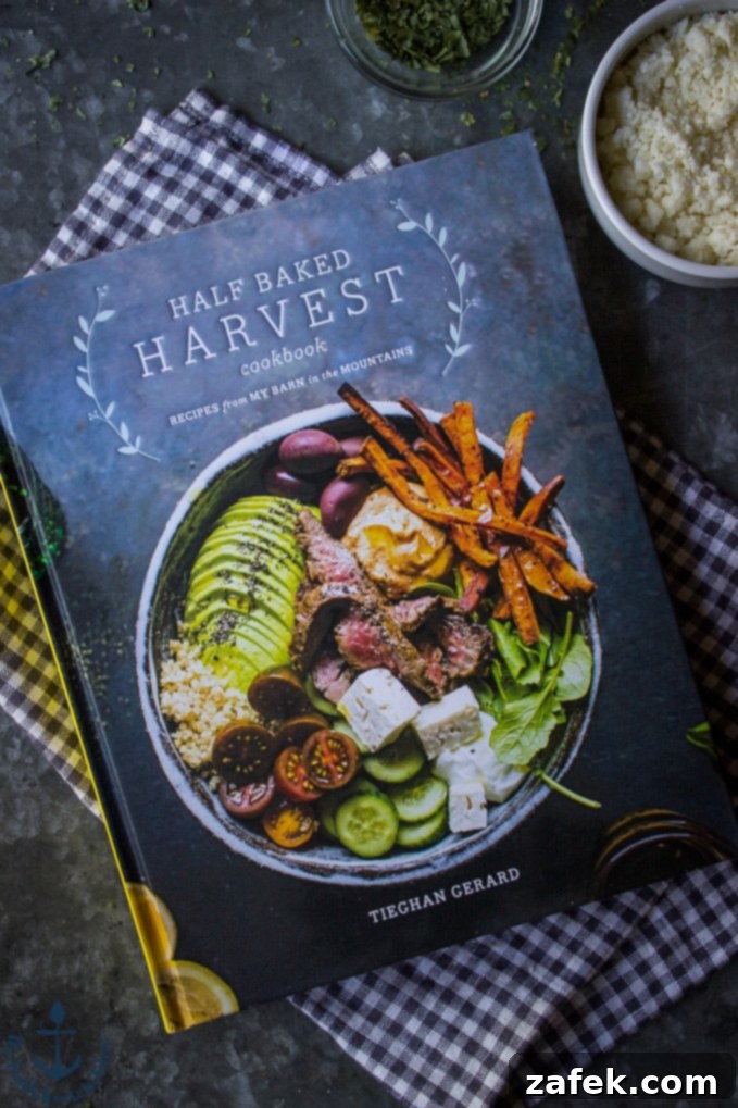 Half Baked Harvest Cookbook: A Culinary Inspiration The Half Baked Harvest Cookbook by Tieghan Gerard, resting on a stylish checked napkin, inviting readers to explore its pages.