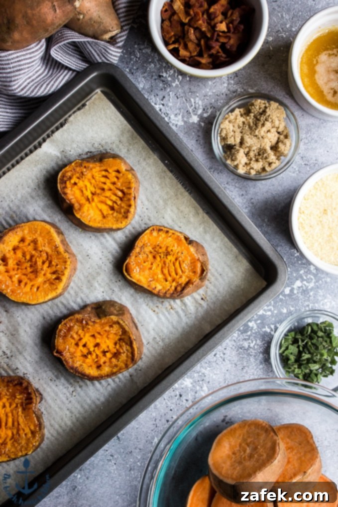 Overhead photo of sweet potato slices on baking sheet, with ingredients in bowls surrounding tray.