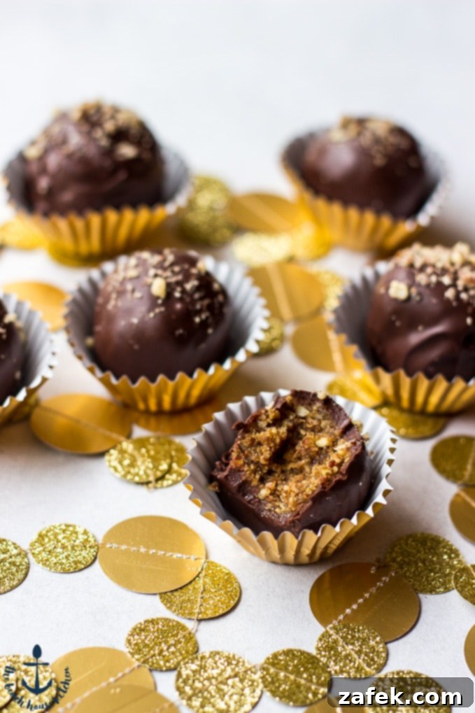 Pecan Pie Truffles, one showing a perfect bite, nestled in festive gold foil cups with gold confetti.
