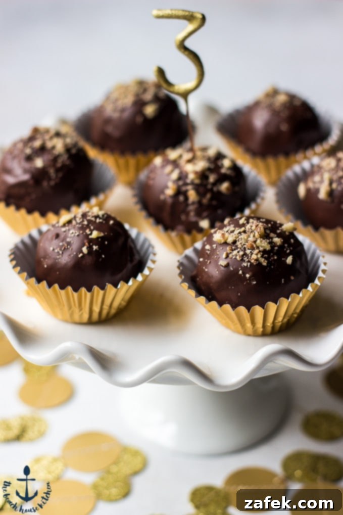 More enticing Pecan Pie Truffles on an elegant white cake stand, highlighting their rich texture and perfect coating.