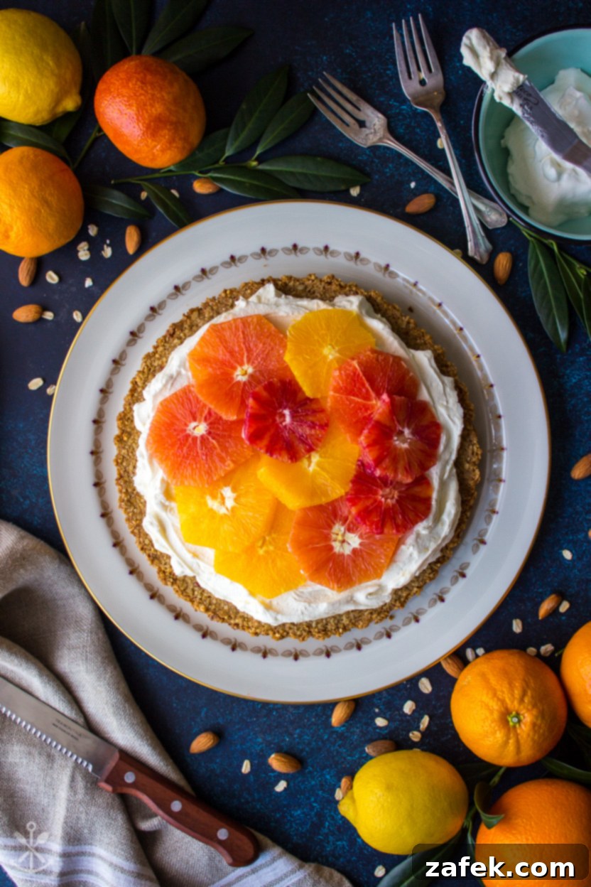 Overhead view of a beautiful mascarpone tart adorned with fresh orange slices
