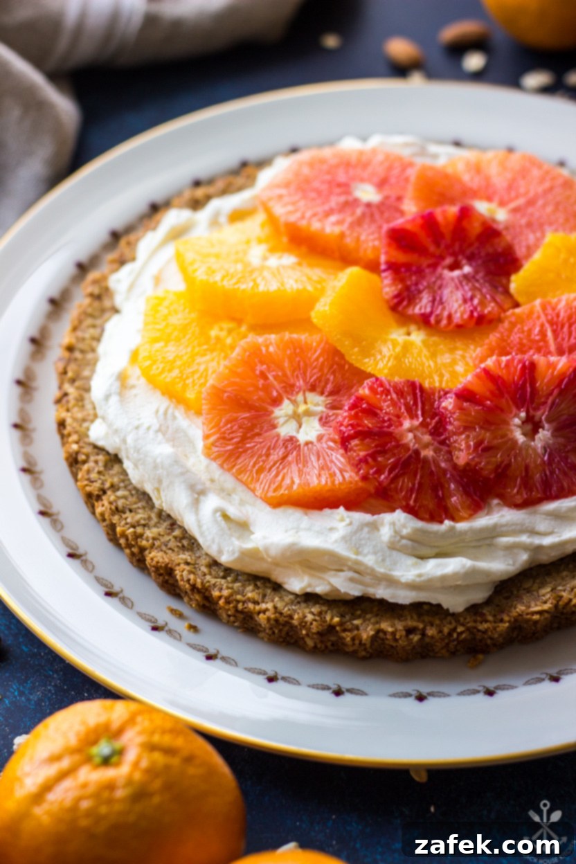 Close-up view of a mascarpone tart, beautifully topped with fresh orange segments