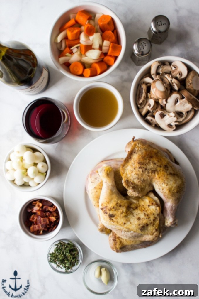 Slow Cooker Coq Au Vin Chicken on a white plate, carrots and onions, bacon, mushrooms, thyme leaves, garlic cloves, pearl onions and chicken broth in white bowls. Salt and pepper shakers, wine glass and red wine.