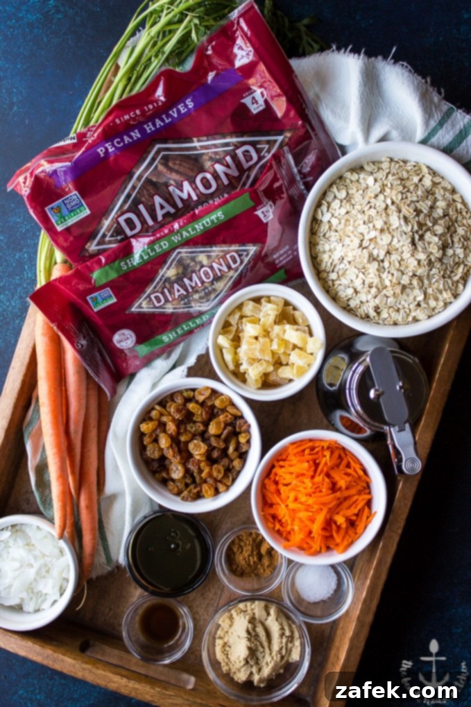 Carrot-Cake-Granola Overhead shot of ingredients for carrot cake granola. Bags of pecans, walnuts, oats, dried pineapple, golden raisins, shredded carrots, coconut, brown sugar in bowls.
