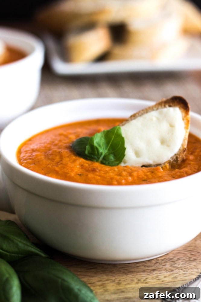 Comforting Tomato Basil Soup with Golden Cheese Toasts 4 Ingredients for creamy tomato basil soup and cheese toasts laid out on a table