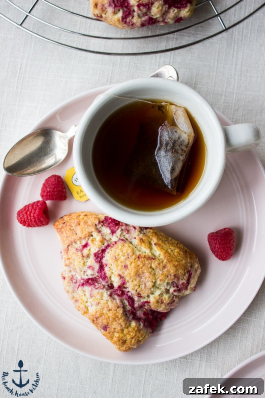 Close-up of a Raspberry Lemon Scone showing fresh raspberries
