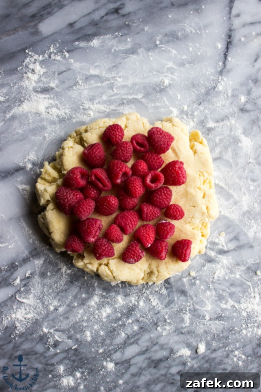 Unbaked Raspberry Lemon Scones shaped and ready for the oven