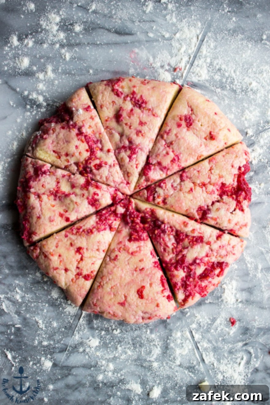 Baked Raspberry Lemon Scones cooling on a wire rack