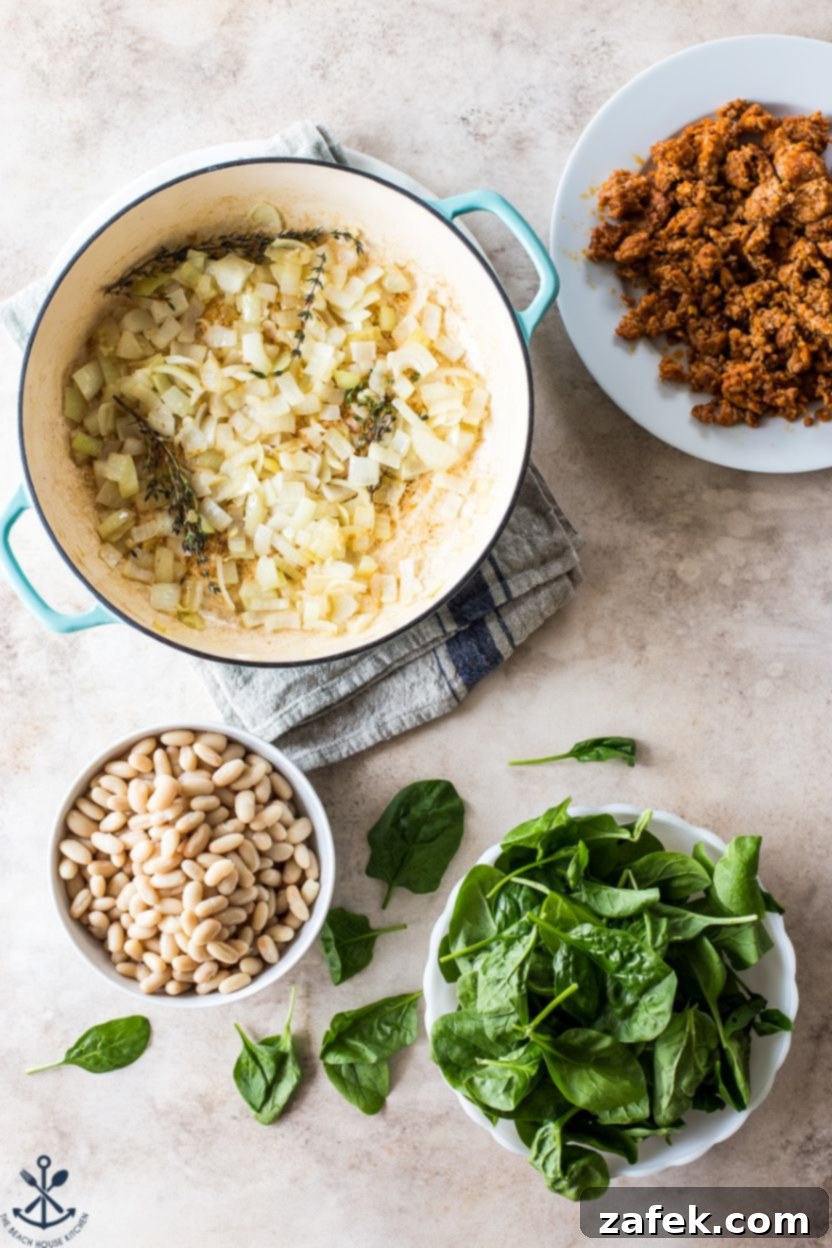 Hearty Chorizo and White Bean Stew 4 Assorted fresh ingredients laid out for White Bean and Chorizo Stew preparation
