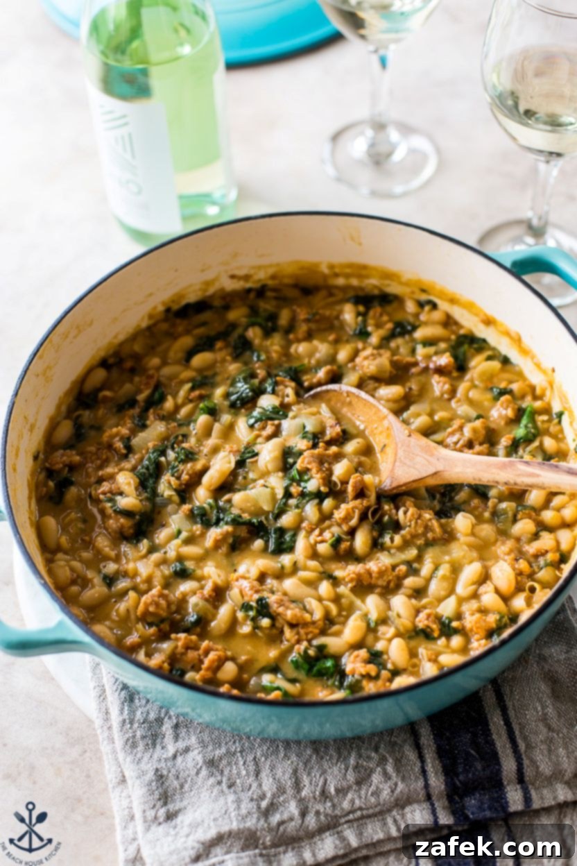 Hearty Chorizo and White Bean Stew 7 A large skillet filled with steaming White Bean and Chorizo Stew, ready to be served