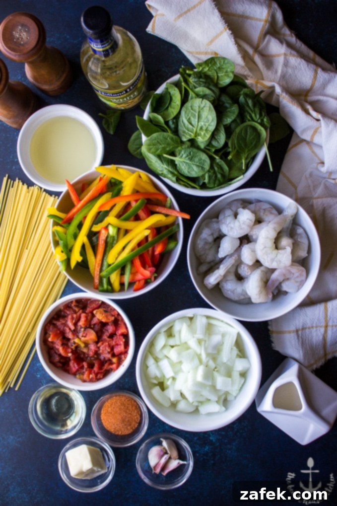 Cajun Shrimp Linguine Overhead photo of ingredients for Cajun Shrimp Linguine in individual bowls.
