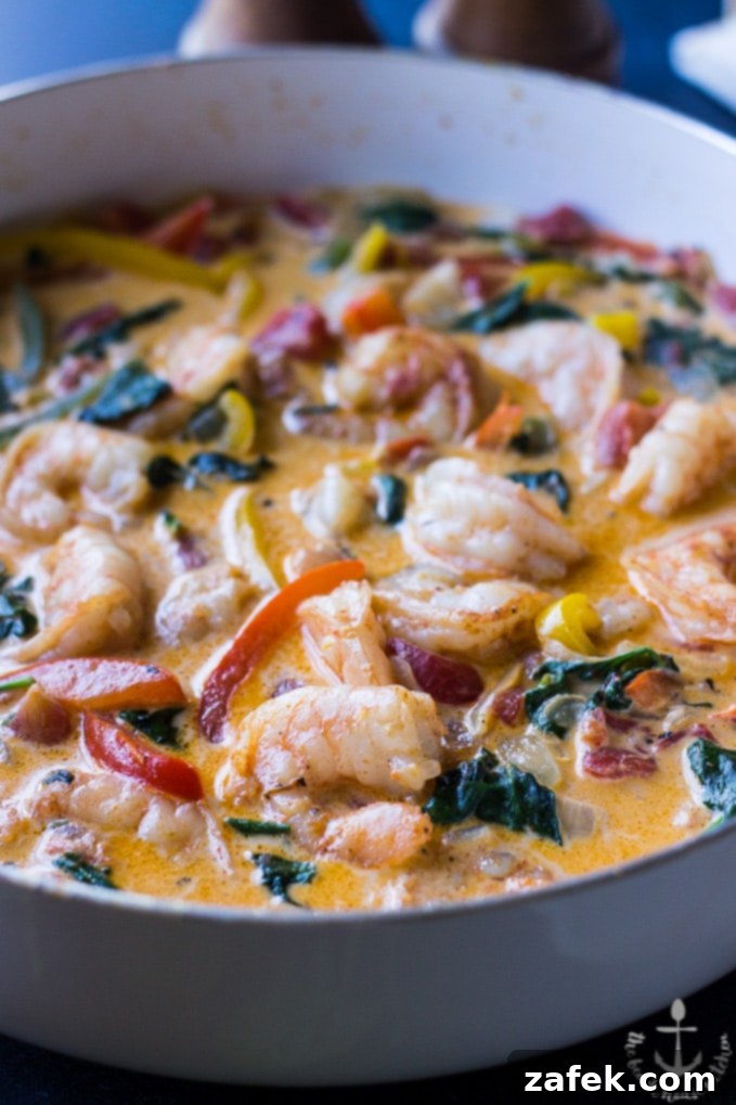 Cajun Shrimp Linguine Cajun Shrimp Linguine in a white skillet.