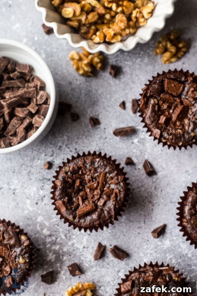Double Chocolate Brownie Cupcakes Two Double Chocolate Brownie Cupcakes on a white plate, highlighting their visual appeal