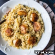 Pan-Seared Scallops with Zesty Orzo Piccata 5 Overhead photo of the Pan Seared Scallops with Orzo Piccata looking extra delicious in a big white plate