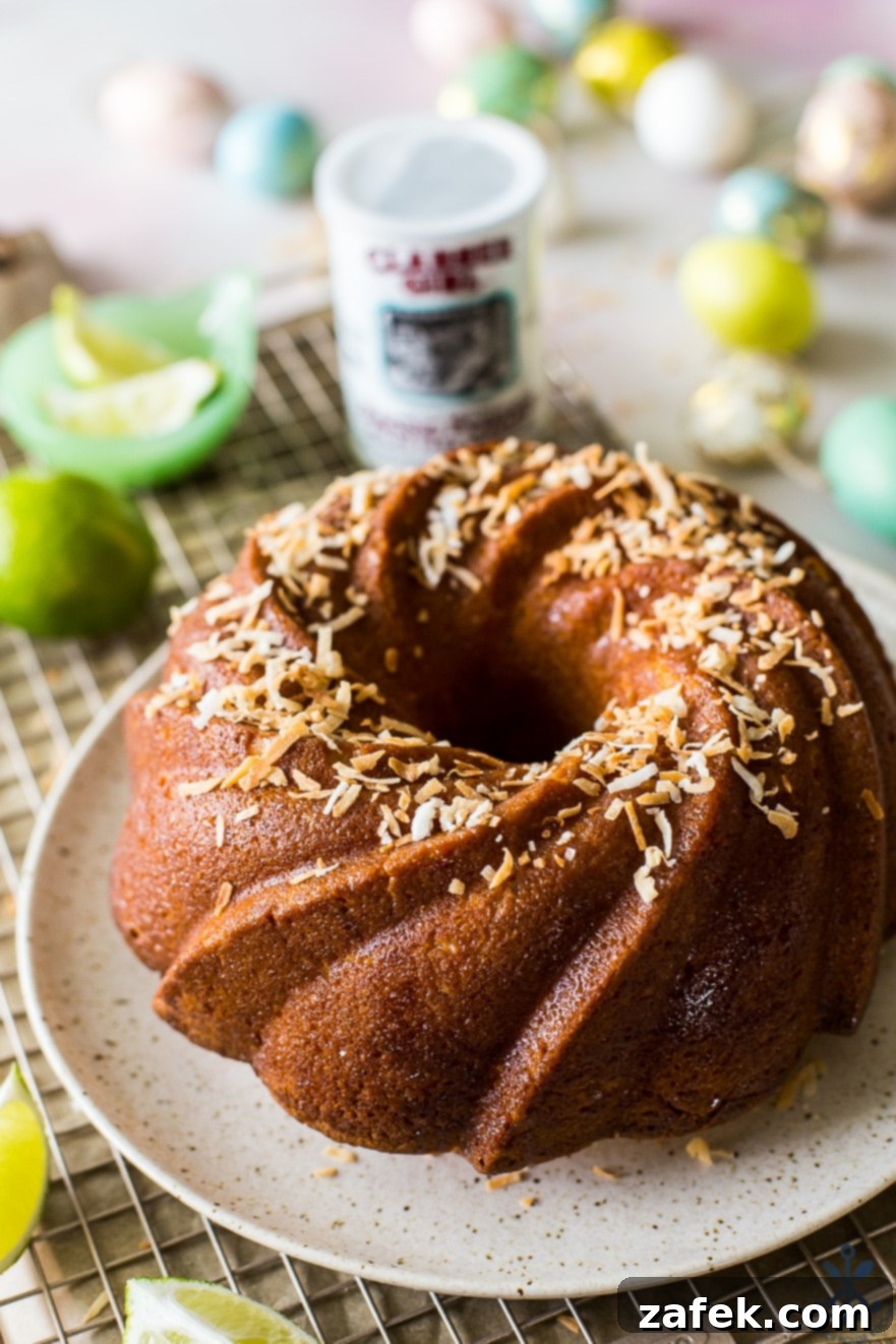 Closeup of the delicious Key Lime Coconut Bundt Cake on a plate on a wire rack