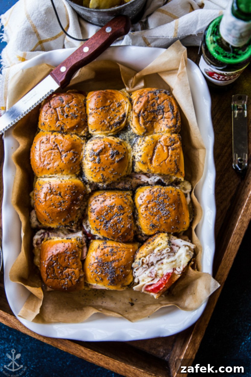 Southern Hot Brown Bites 2 Overhead photo of a baking dish of sliders with turkey and tomatoes