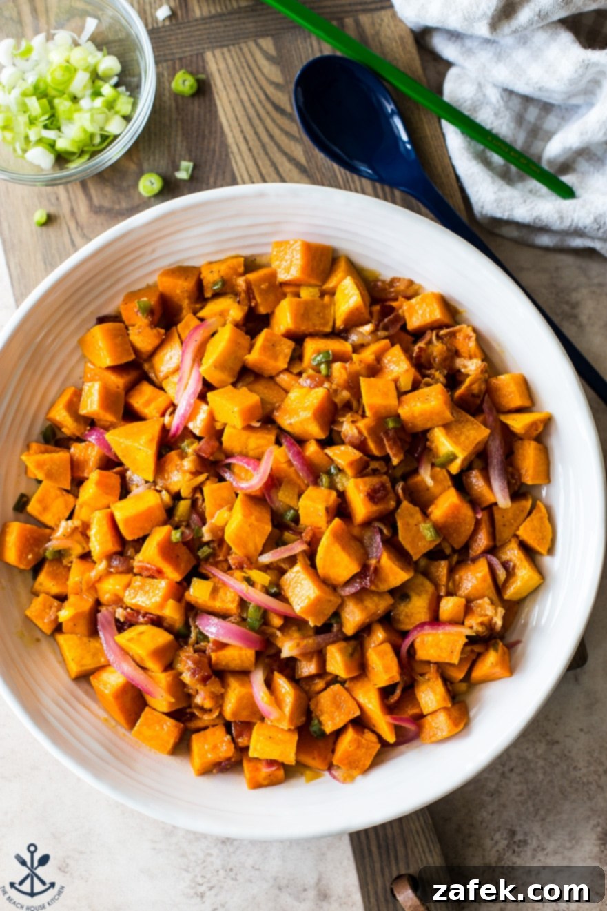 Fiery Sweet Potato Delight 5 Overhead photo of white bowl filled with spicy sweet potato salad